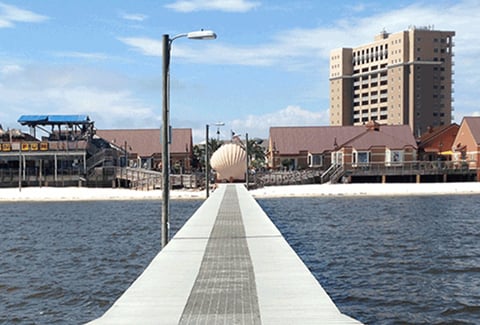 A pier stretches into the water at Gulf Islands National Seashore.