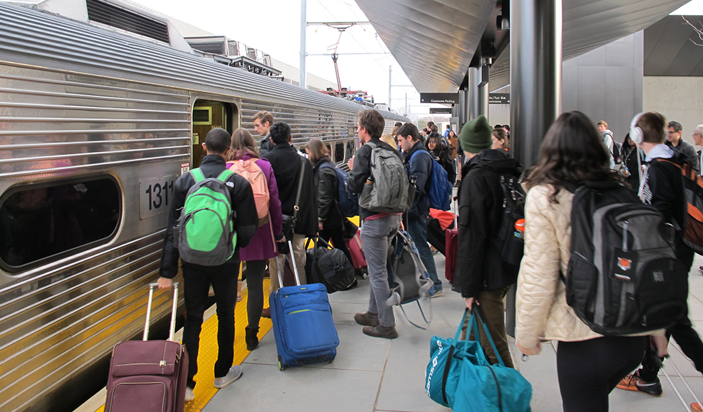 Students board train at Dinky station.