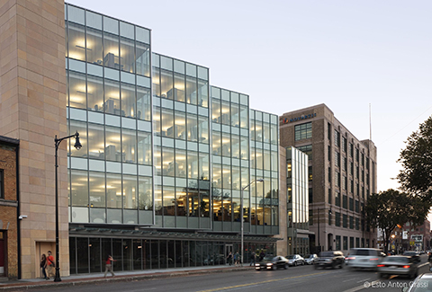 The Novartis Institutes for Biomedical Research is seen from across Massachusetts Avenue. A view of the gateway into the Novartis Institutes for Biomedical Research at dusk.