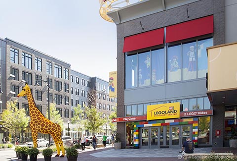 A giraffe statue welcomes visitors outside of the Lego store at Assembly Row.