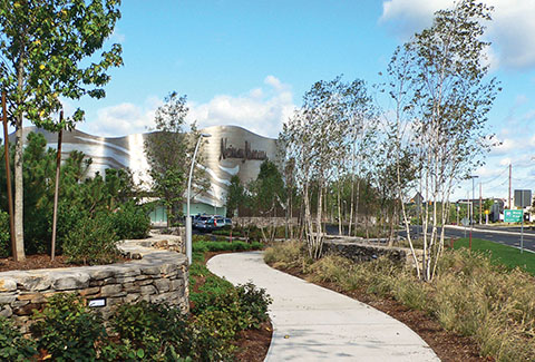 Neiman Marcus in the distance from the landscaped walking path at the Natick Mall.