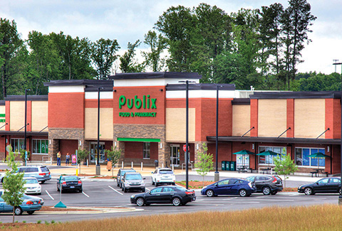 Publix grocery store storefront and parking lot in Apex, North Carolina.