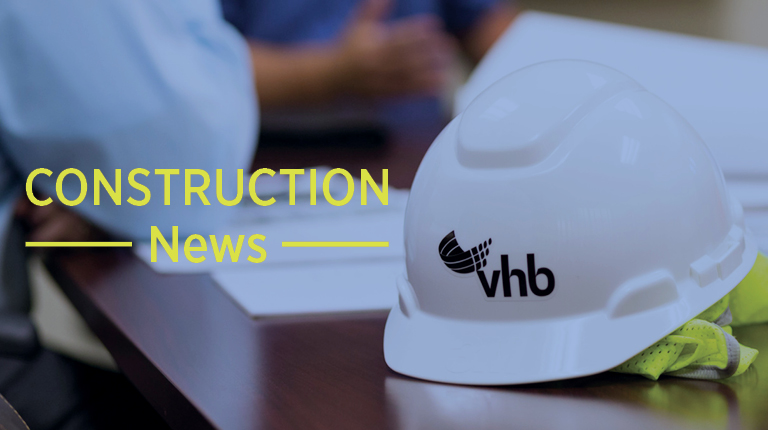 White construction hat sitting on a conference table