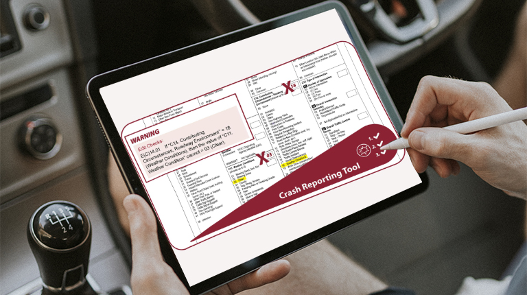 A person using a tablet that contains the fillable crash reporting tool document that contains crash details.