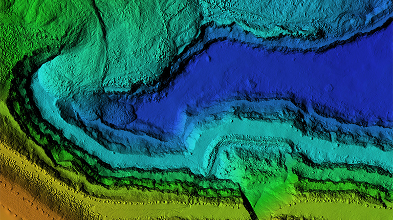 DEM - digital elevation model. Product made after proccesing pictures taken from a drone. It shows excavation site with steep rock walls