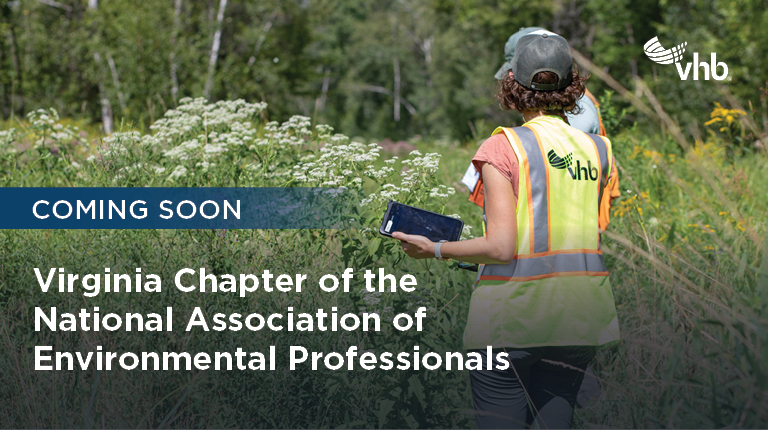 Environmental professional holding a tablet in the field.