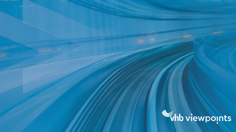 A road in a tunnel with blue lines to demonstrate movement.