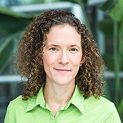 Lauren Blackburn outside wearing a green shirt. 